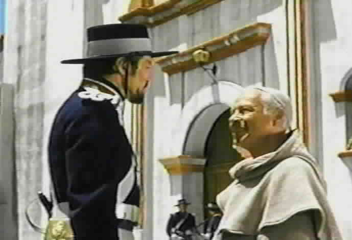 Padre Felipe tells Monastario that Don Nacho is seeking refuge at the mission.