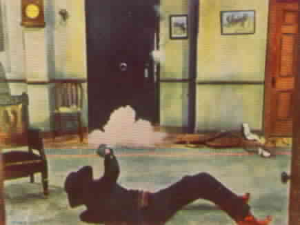 Zorro rolls away from the door to avoid being killed.