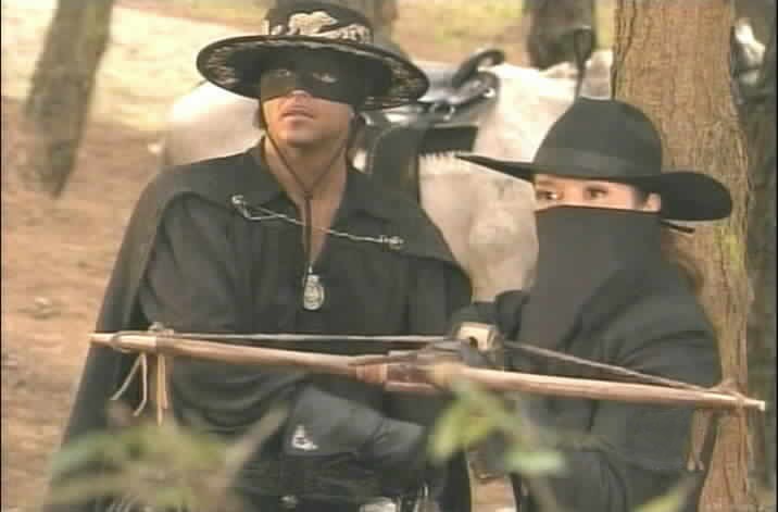 Zorro and Esmeralda are surprised to see Olmos.