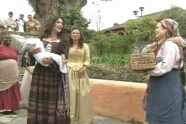 Sara Kali shows her grandson to the gyspies.