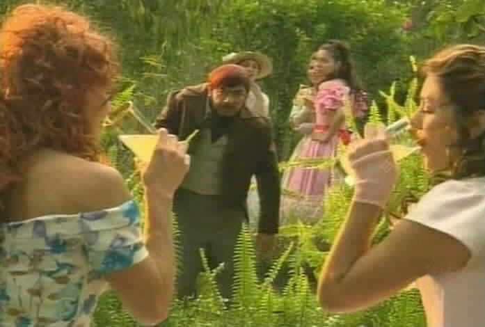 Olmos wears his orange hairpiece.