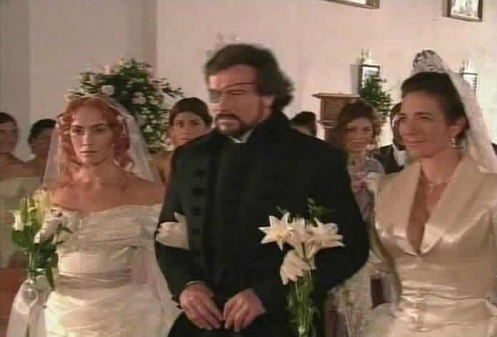 Fernando escorts Mariangel and Almudena down the aisle.