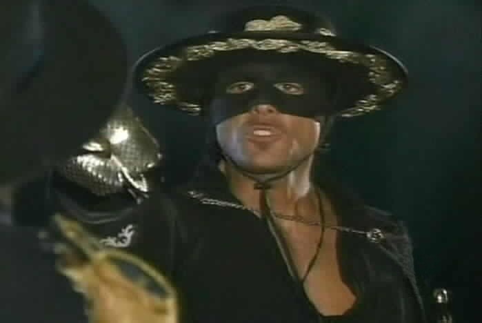 Zorro holds a sword to Montero's throat.