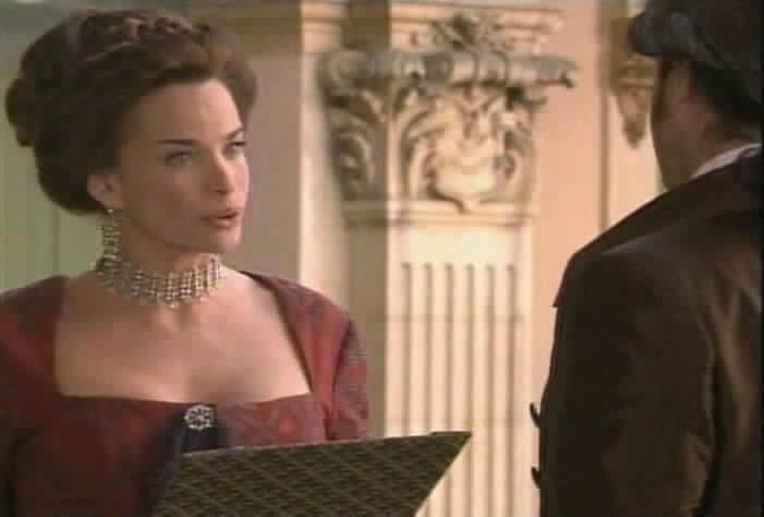 The Queen asks the Duke why he pays Olmos so much money.