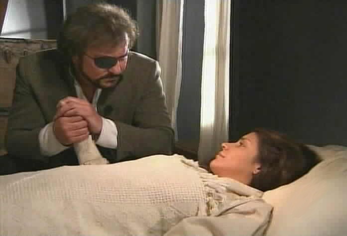 Fernando stays by Maria Pia's bed.