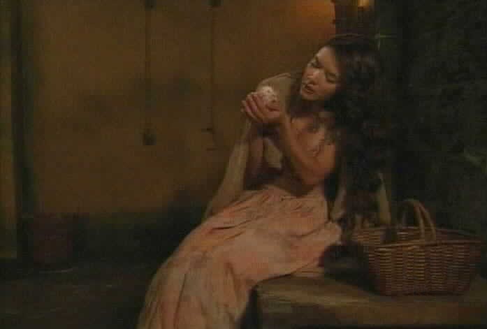 Esmeralda tries to feed Lucrecia.