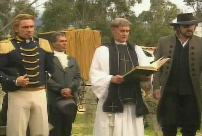 Padre Tomas begins the service.