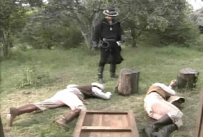 Zorro knocks down the thugs.