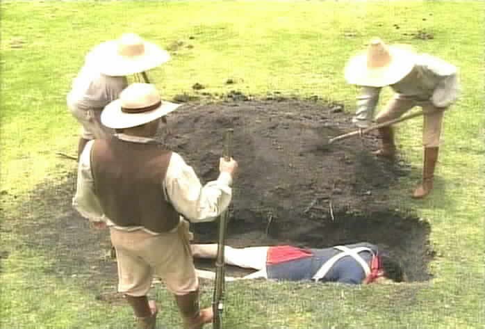 The men bury Aguirre.