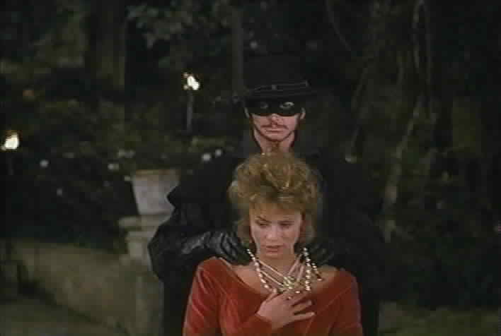 Zorro gives Florinda's necklace to Charlotte.
