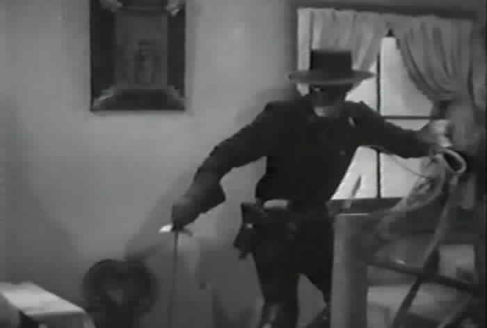 Zorro arrives to fight the bandit.